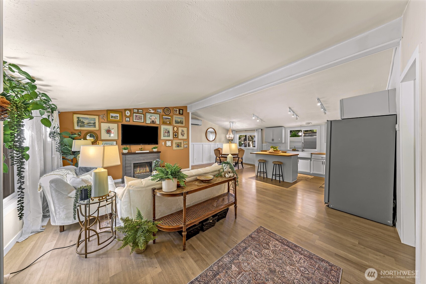 1014 West Smith Road, Unit 36 Bellingham, WA 98226 - Photo 3 of 32 a living room with furniture and a flat screen tv