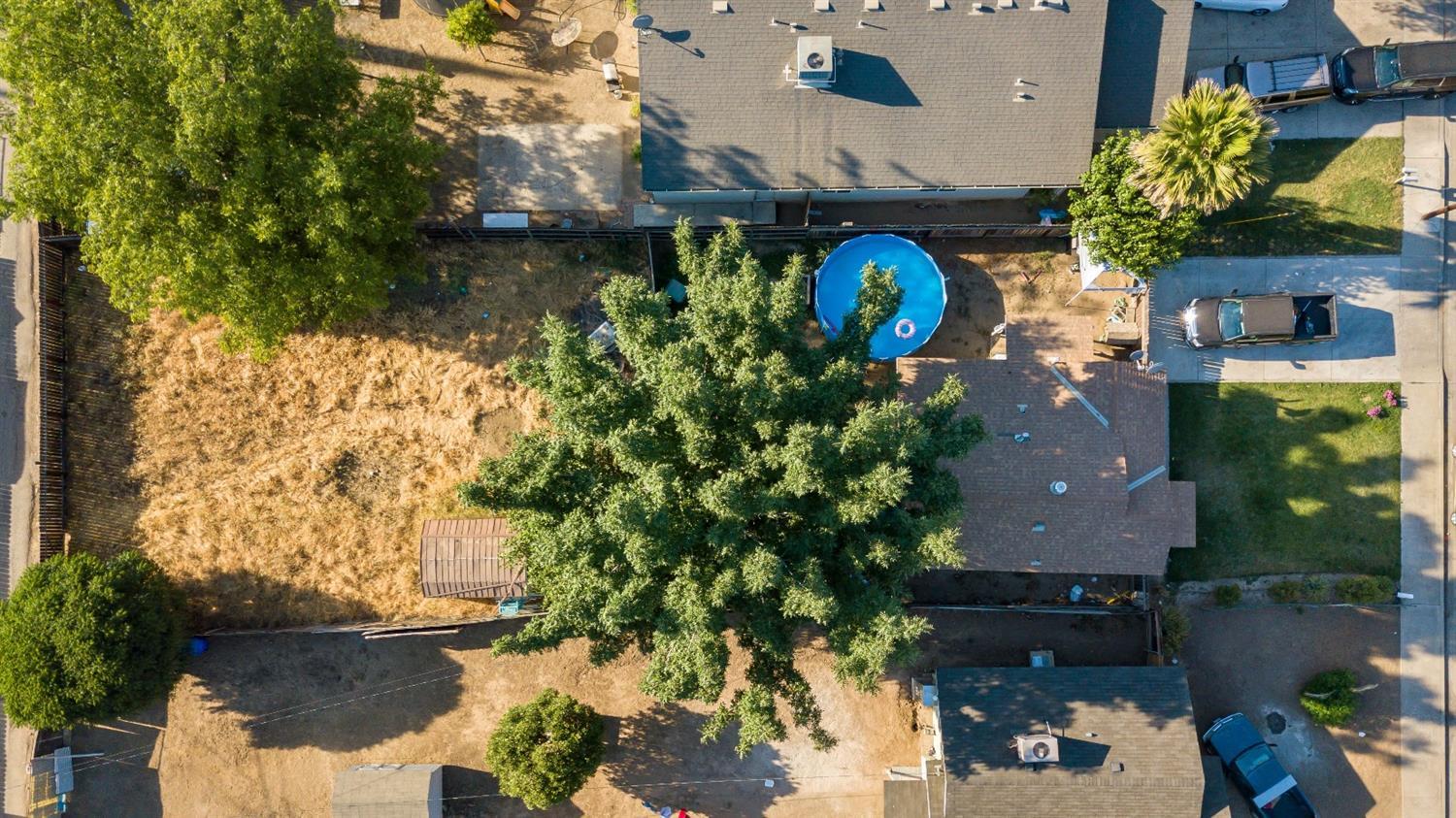 334 North Filbert Road Exeter, CA 93221 - Photo 4 of 6 an aerial view of a house with a lake view