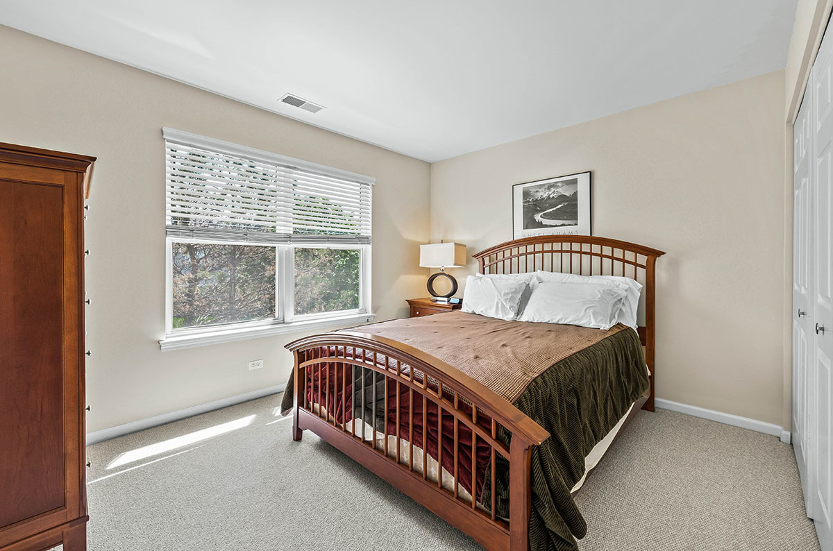 3058 Crystal Rock Road, Unit 3058 Naperville, IL 60564 - Photo 14 of 21 a bedroom with a bed window and a window