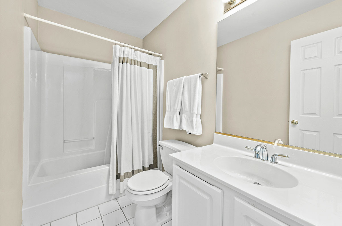 3058 Crystal Rock Road, Unit 3058 Naperville, IL 60564 - Photo 17 of 21 a bathroom with a sink toilet and shower
