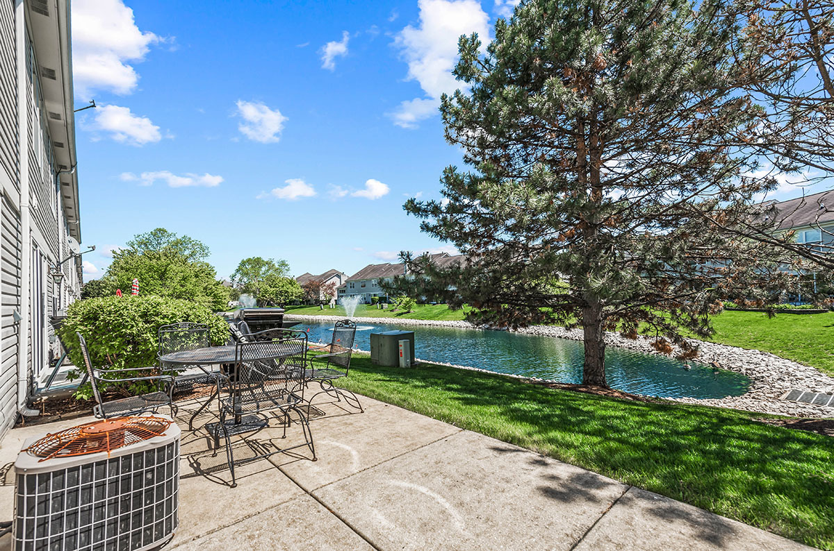 3058 Crystal Rock Road, Unit 3058 Naperville, IL 60564 - Photo 18 of 21 a garden view with a seating space