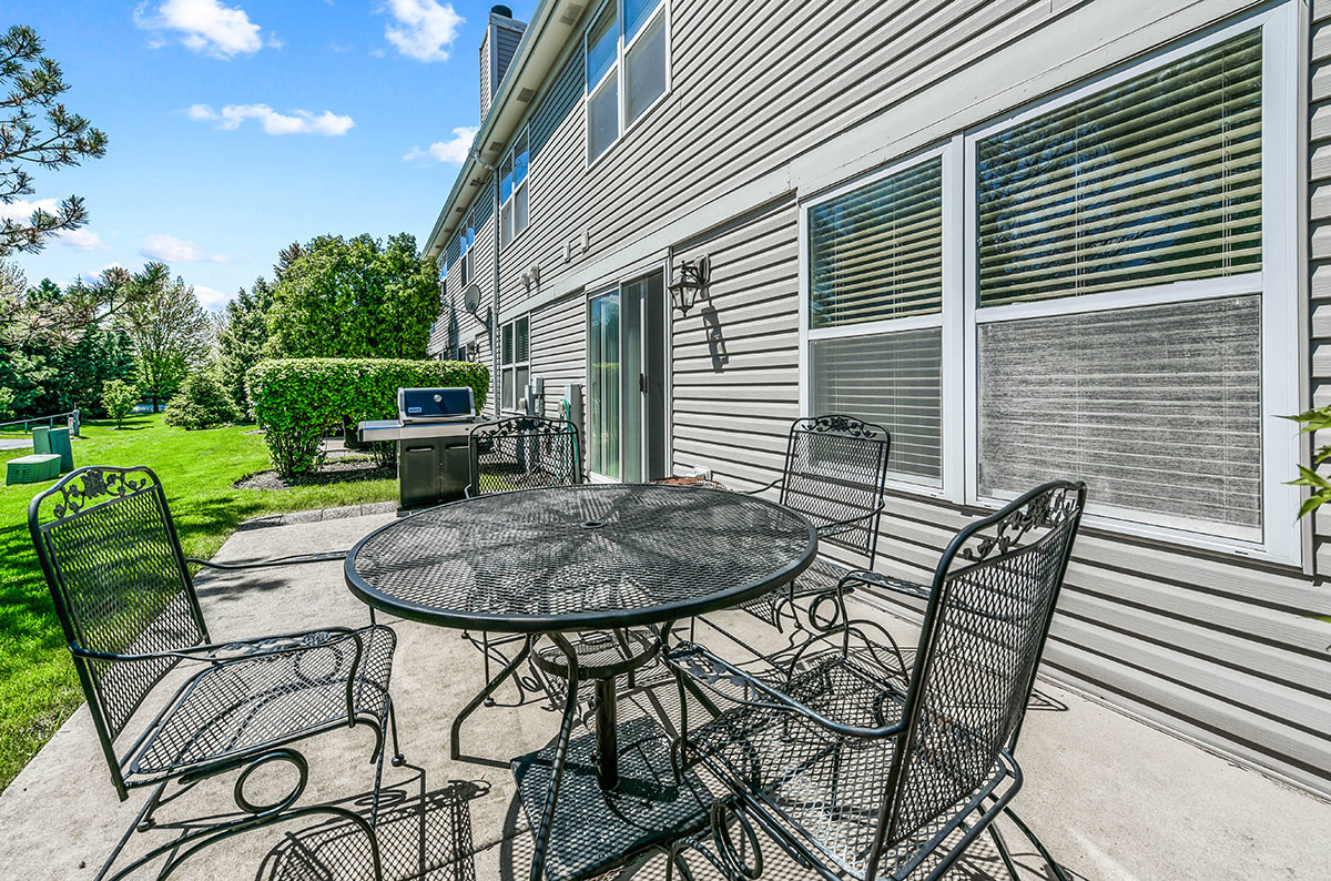 3058 Crystal Rock Road, Unit 3058 Naperville, IL 60564 - Photo 20 of 21 a backyard of a house with outdoor seating