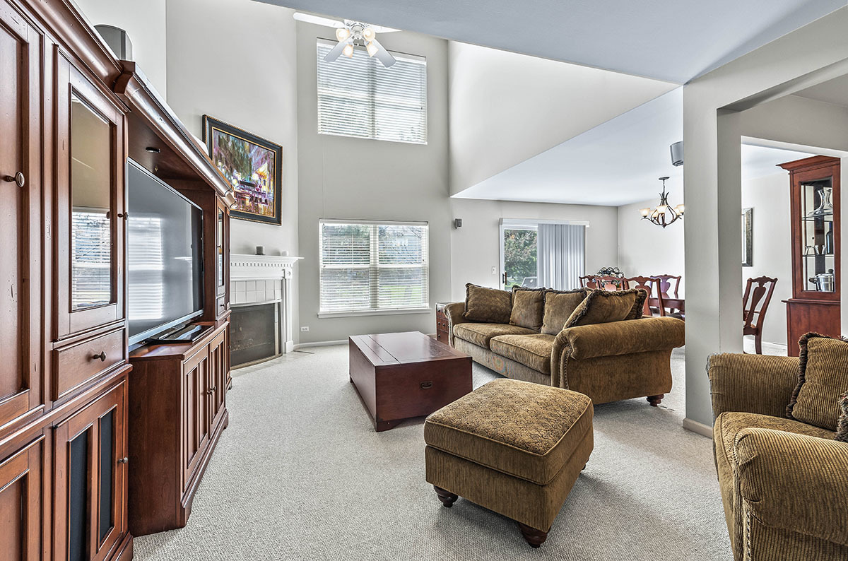 3058 Crystal Rock Road, Unit 3058 Naperville, IL 60564 - Photo 6 of 21 a living room with furniture and a window