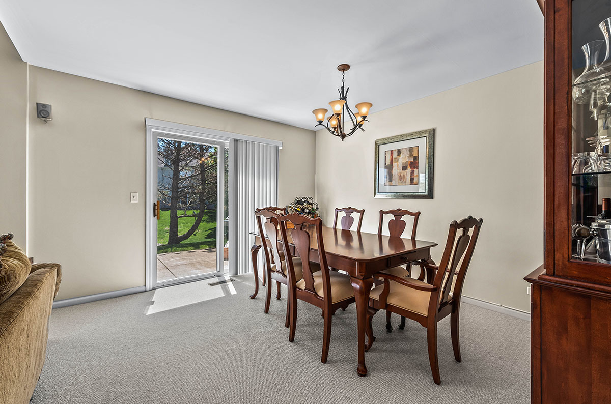 3058 Crystal Rock Road, Unit 3058 Naperville, IL 60564 - Photo 8 of 21 a view of a dining room with furniture