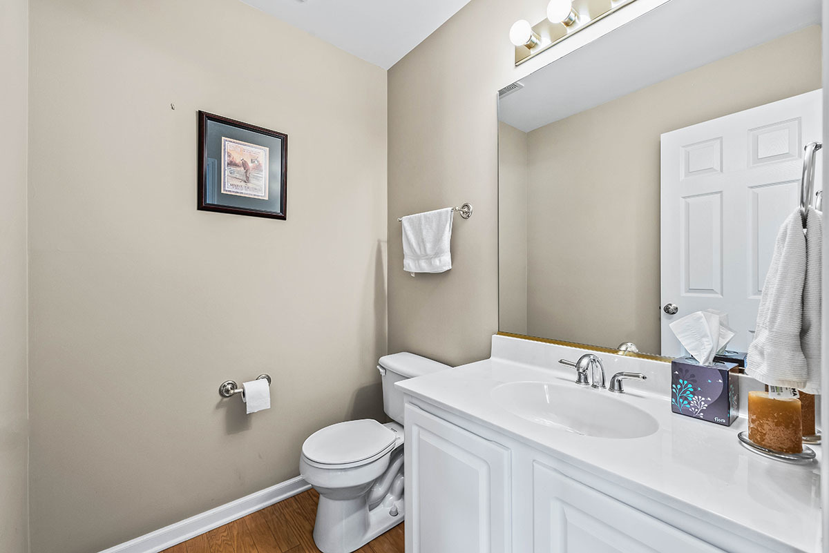 3058 Crystal Rock Road, Unit 3058 Naperville, IL 60564 - Photo 9 of 21 a bathroom with a sink a toilet and mirror