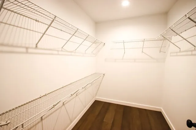 a bathroom with a toilet a sink and a mirror