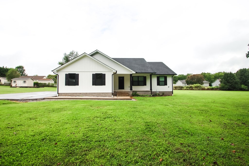 191 Rustling Oaks Drive Sparta, TN 38583 - Photo 4 of 20 a front view of a house with yard and green space