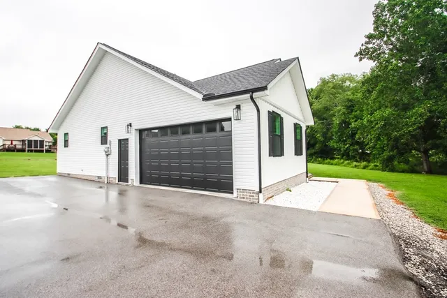 a view of a kitchen with a sink and a refrigerator