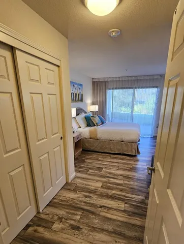 a bedroom with a bed and a couch