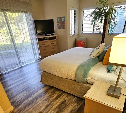 a living room with furniture and flowers