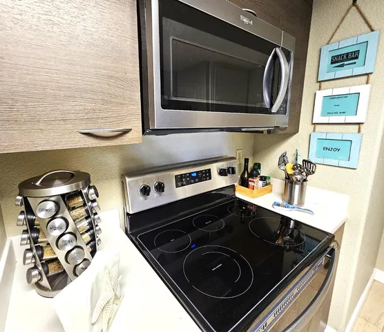 a close view of a stove and a microwave