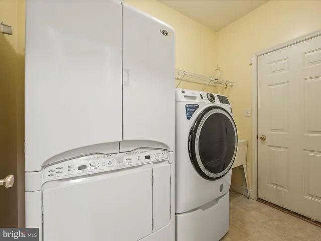 a spacious bathroom with a double vanity sink and a mirror