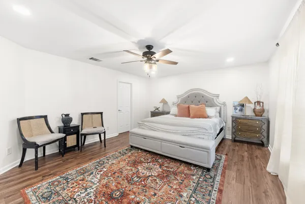 a bedroom with a bed and a table in it