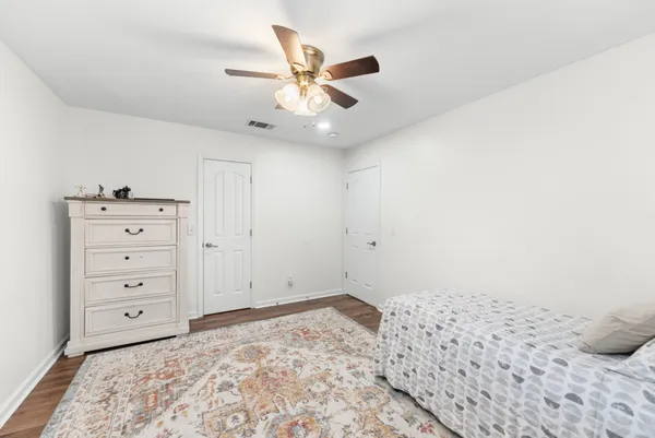 a very nice looking room with a ceiling fan