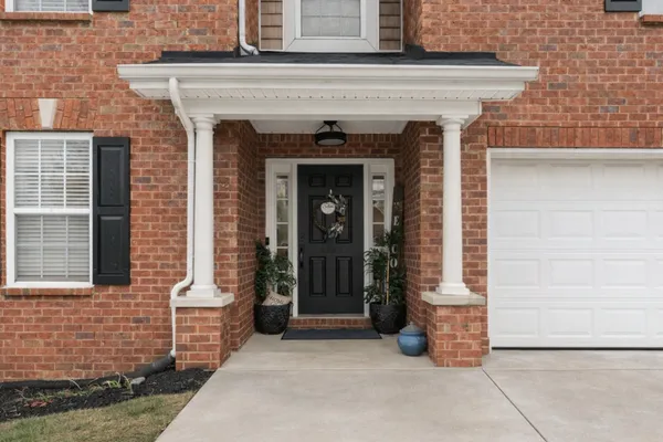 a front view of a house with glass windows
