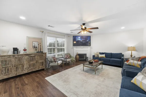 a living room with furniture and a fireplace
