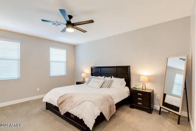 a bedroom with a bed and window