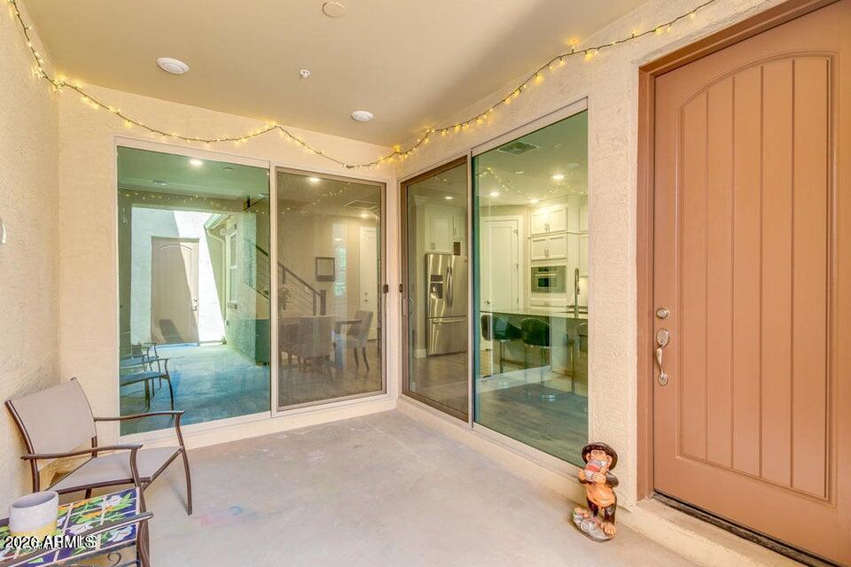 3855 South McQueen Road, Unit 14 Chandler, AZ 85286 - Photo 2 of 31 a view of a hallway with wooden shelves