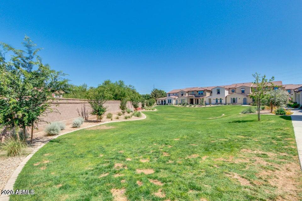 3855 South McQueen Road, Unit 14 Chandler, AZ 85286 - Photo 25 of 31 a view of a house with a yard