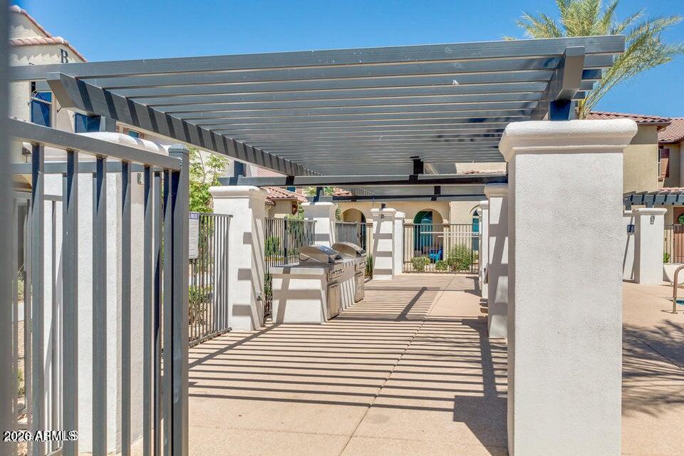 3855 South McQueen Road, Unit 14 Chandler, AZ 85286 - Photo 27 of 31 a view of a balcony and floor to ceiling window