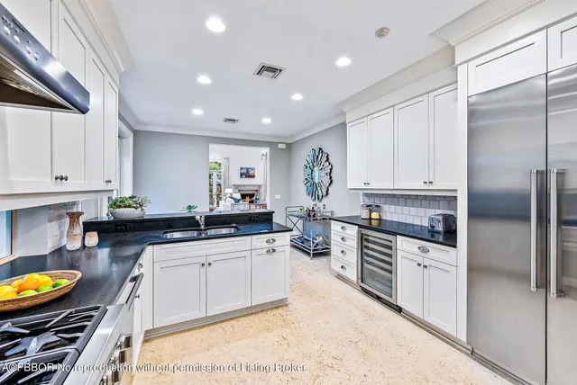 a view of a dining room with furniture a rug and wooden floor