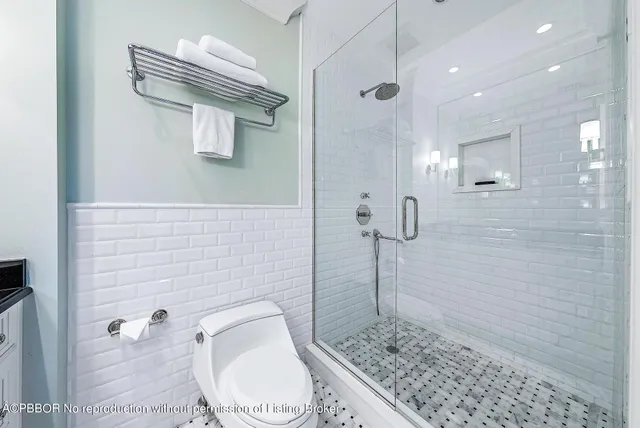 a spacious bedroom with a bed and a couch