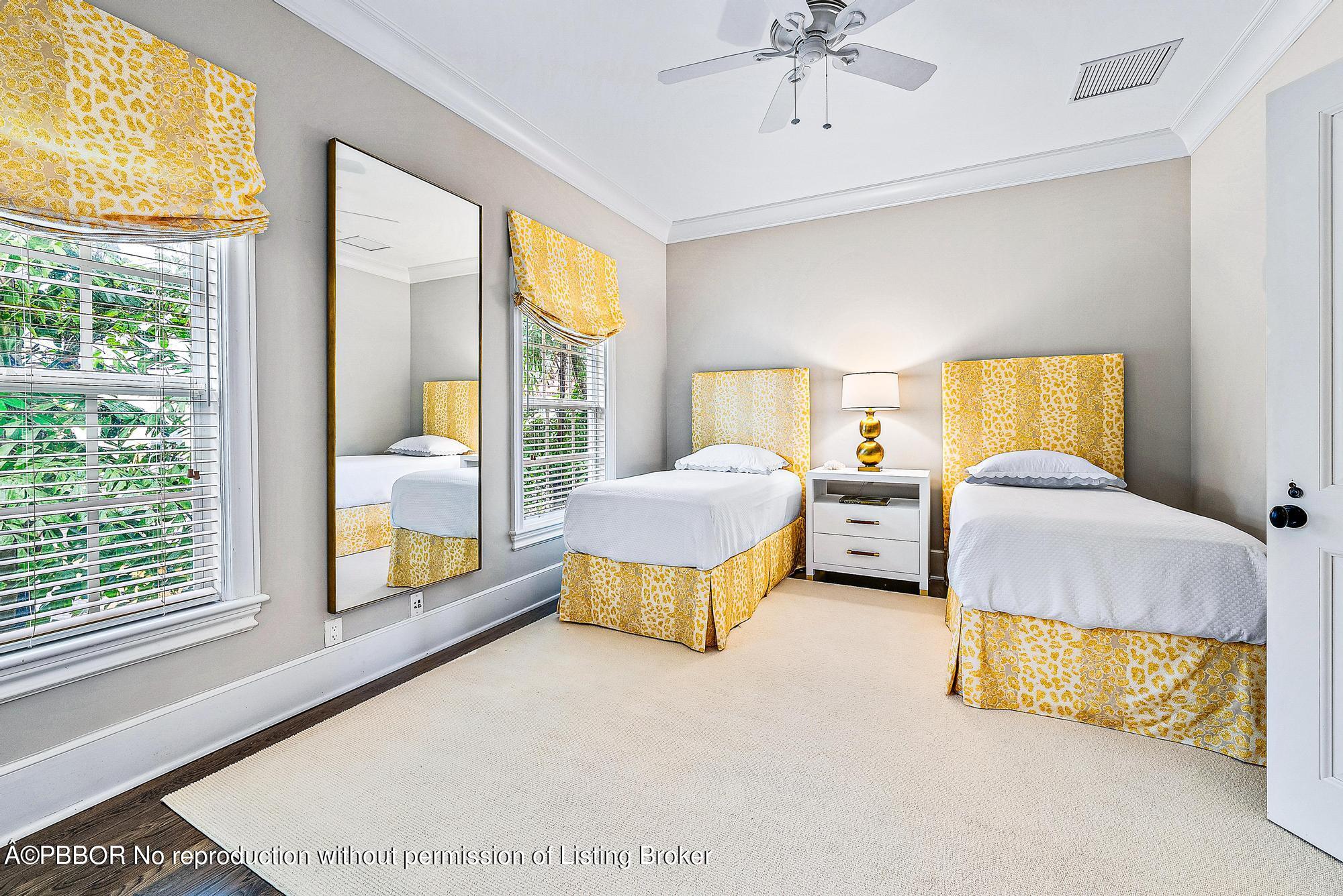 165 Root Trail Palm Beach, FL 33480 - Photo 22 of 26 a spacious bedroom with a bed and a couch