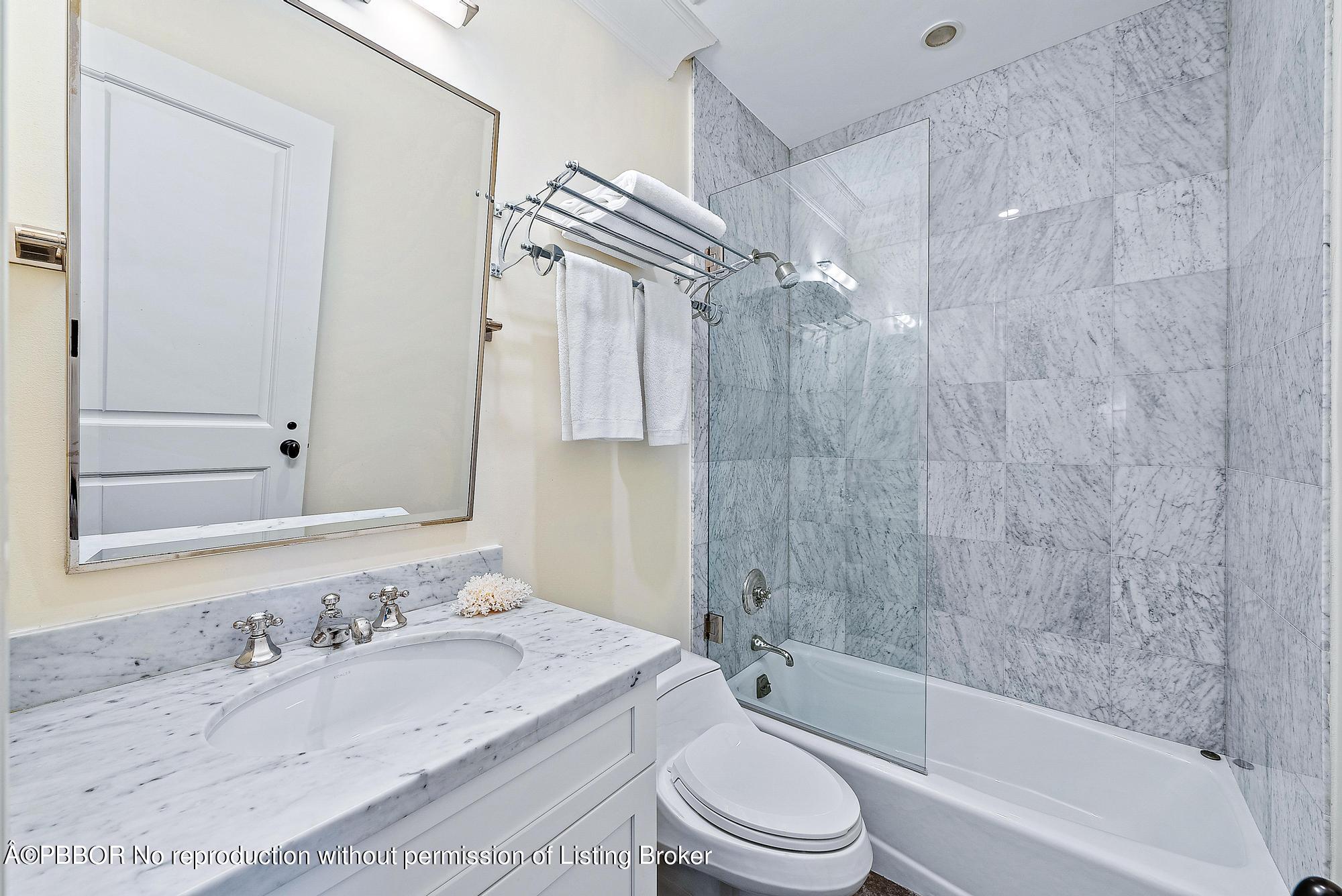 165 Root Trail Palm Beach, FL 33480 - Photo 23 of 26 a bathroom with a granite countertop sink toilet and shower