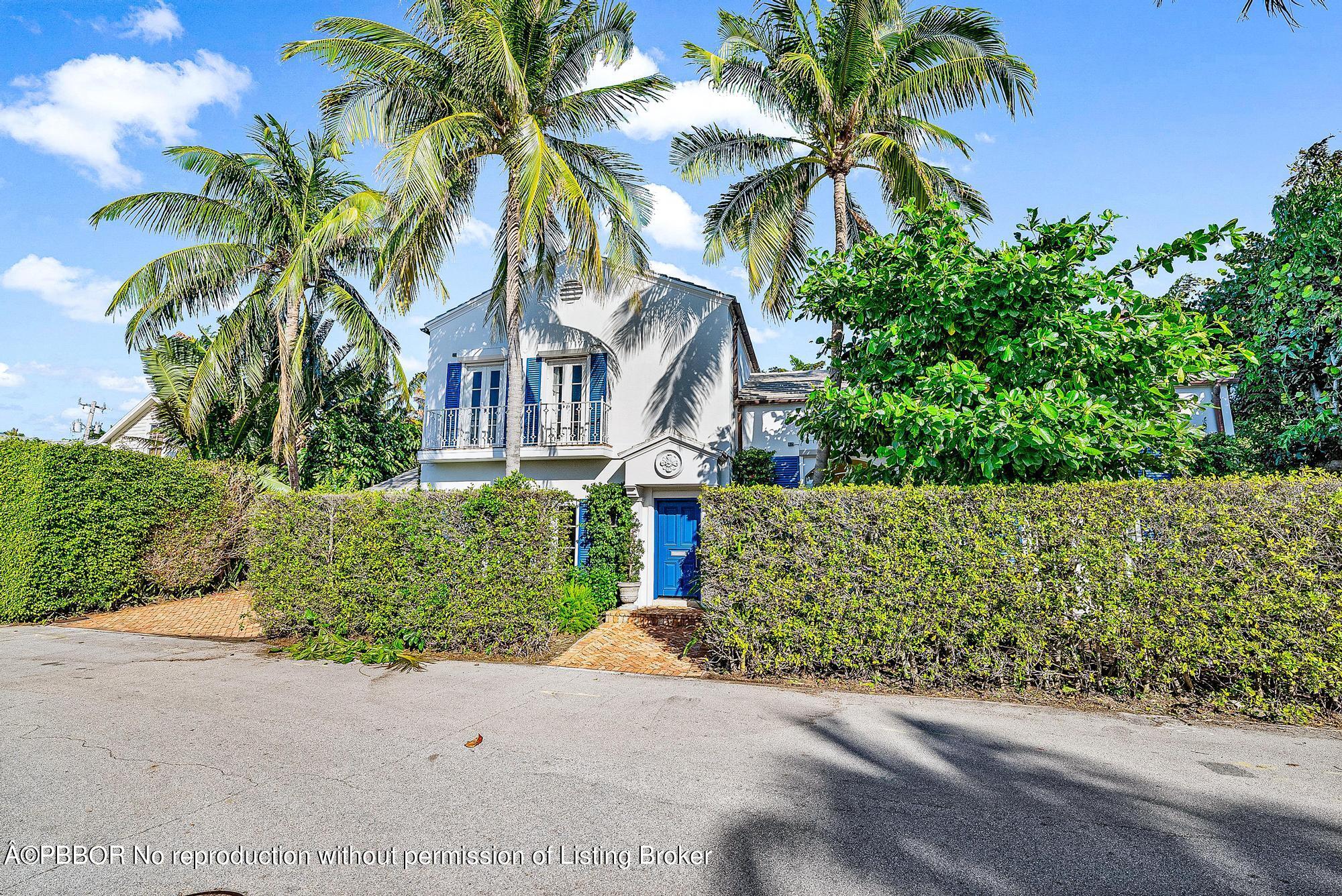165 Root Trail Palm Beach, FL 33480 - Photo 4 of 26 front view of a house with a street