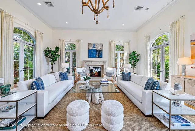 a living room with furniture or chandelier and a dining table