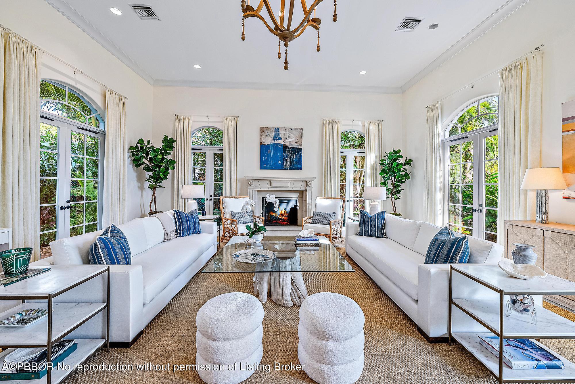 165 Root Trail Palm Beach, FL 33480 - Photo 5 of 26 a living room with furniture potted plant and a large window