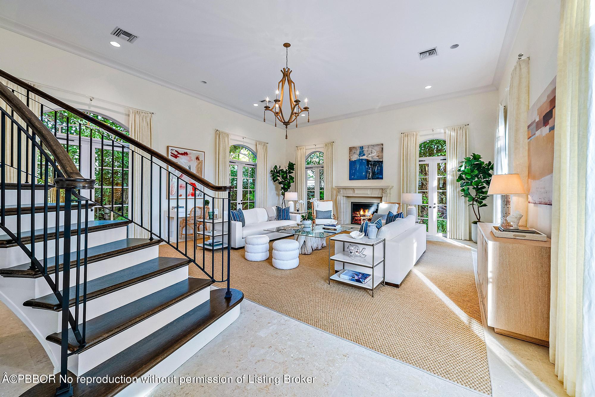 165 Root Trail Palm Beach, FL 33480 - Photo 6 of 26 a living room with furniture or chandelier and a dining table