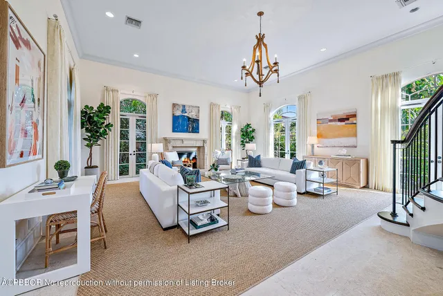 a living room with furniture dining table and a large window