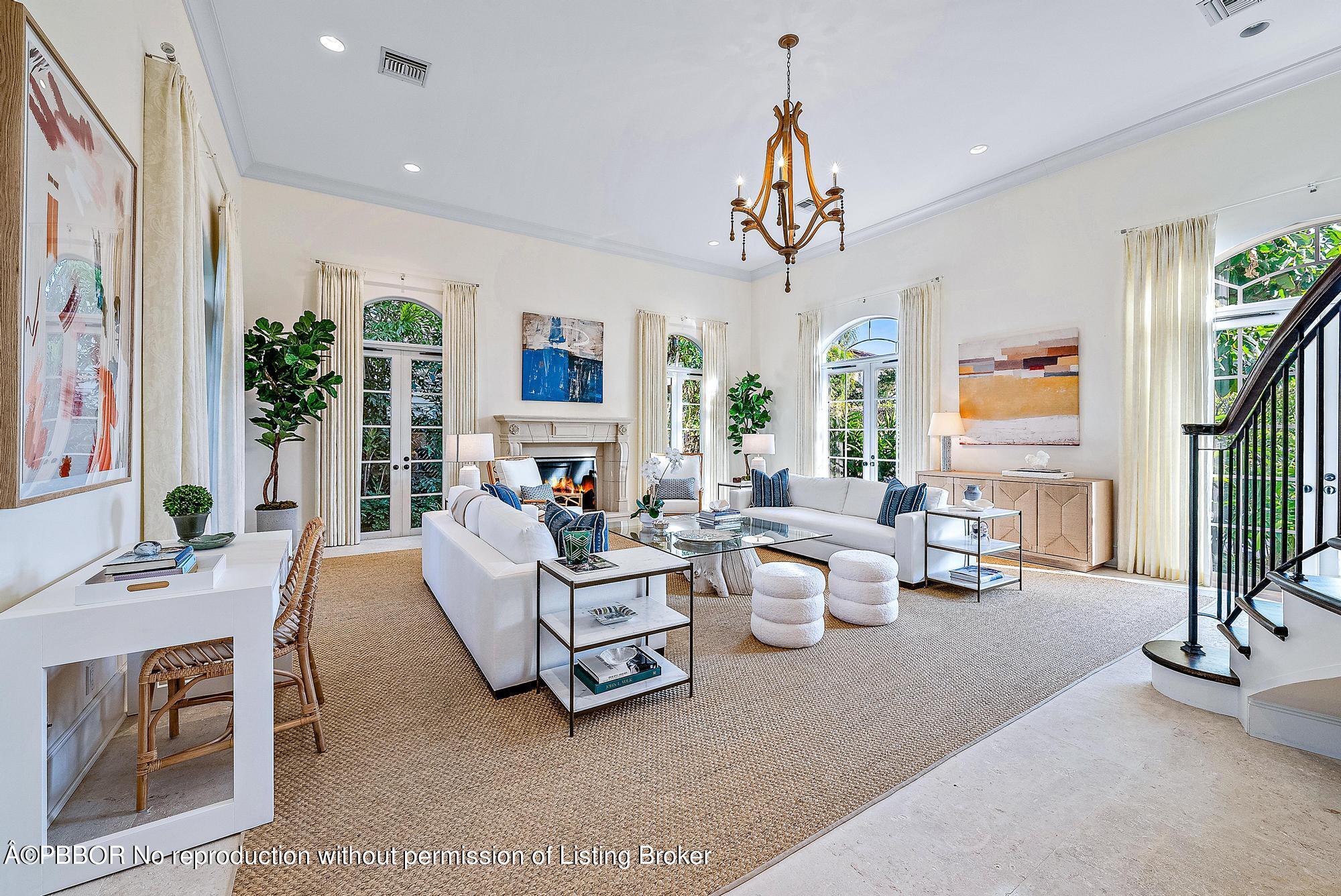 165 Root Trail Palm Beach, FL 33480 - Photo 7 of 26 a living room with furniture and a chandelier