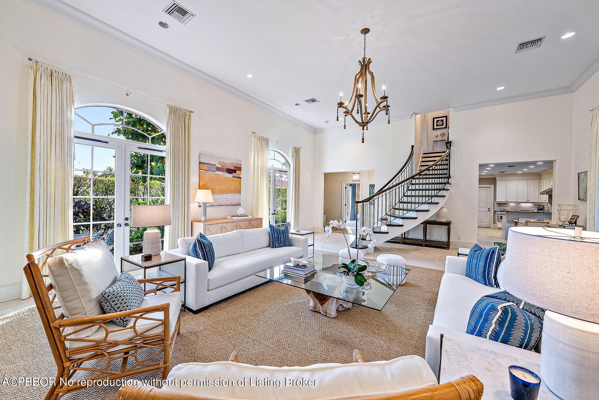 165 Root Trail Palm Beach, FL 33480 - Photo 8 of 26 a living room with furniture dining table and a large window