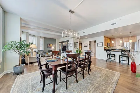 a view of a dining room with furniture window and wooden floor