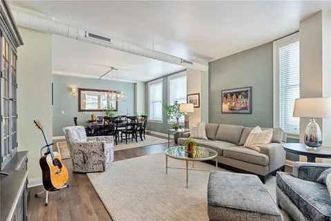 a bedroom with a large bed and a flat screen television