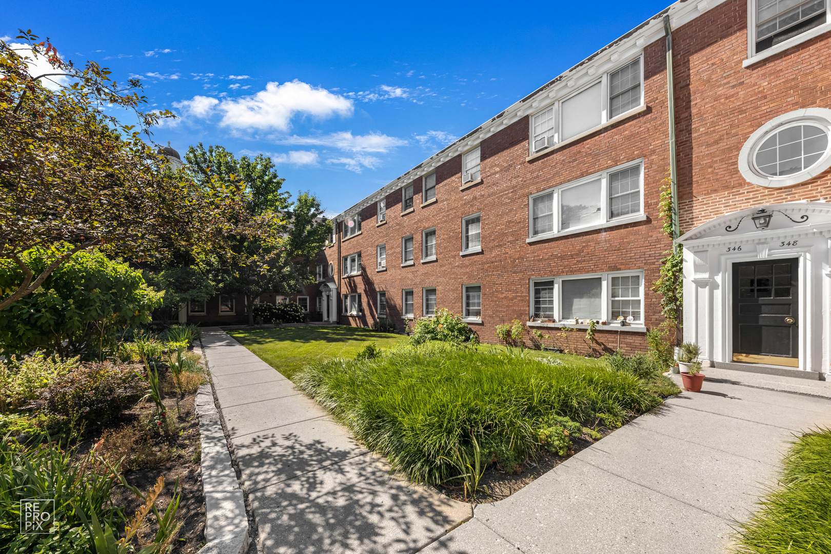 348 Ridge Avenue, Unit 1 Evanston, IL 60202 - Photo 2 of 9 a view of a building with a yard