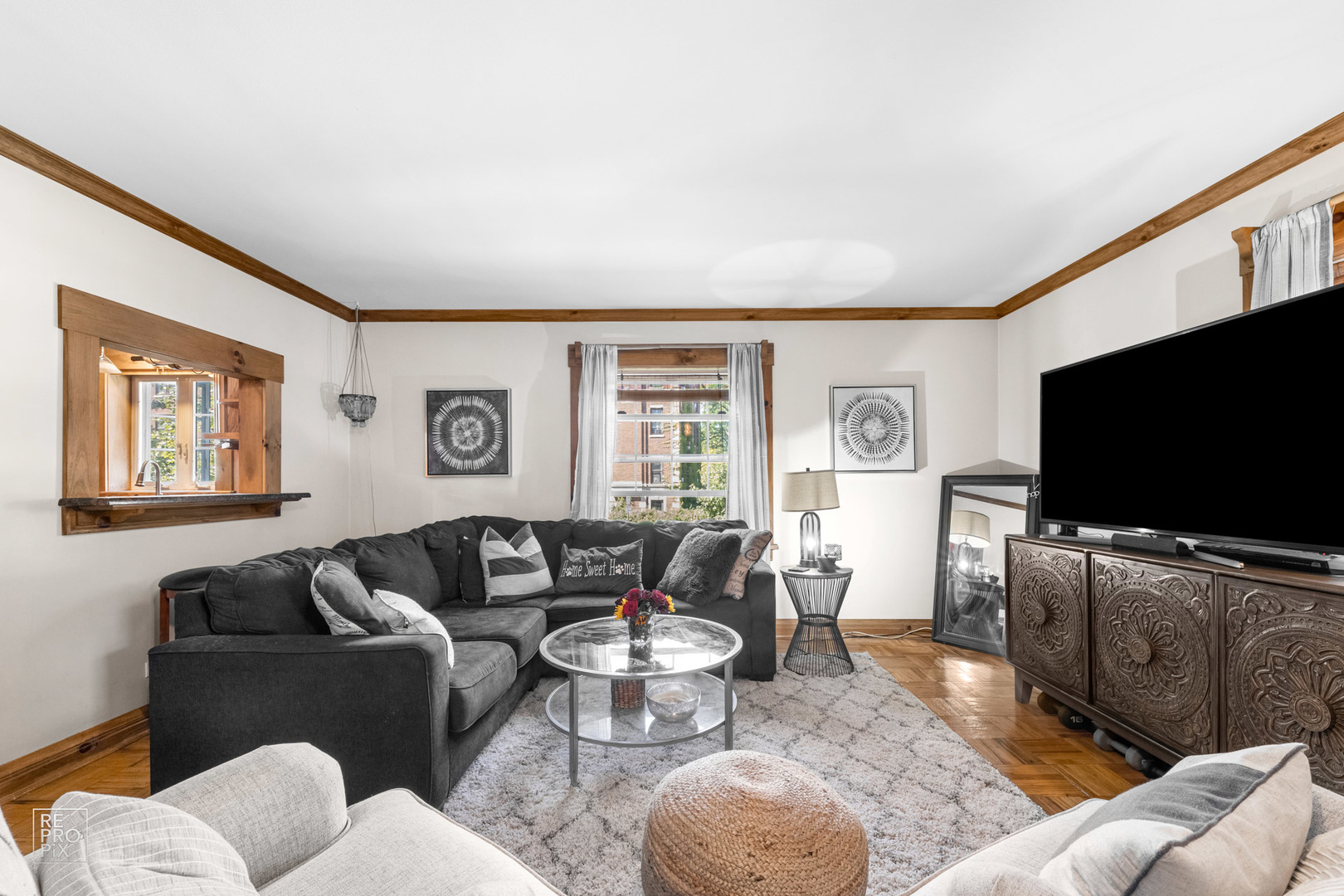 348 Ridge Avenue, Unit 1 Evanston, IL 60202 - Photo 5 of 9 a living room with furniture and a flat screen tv