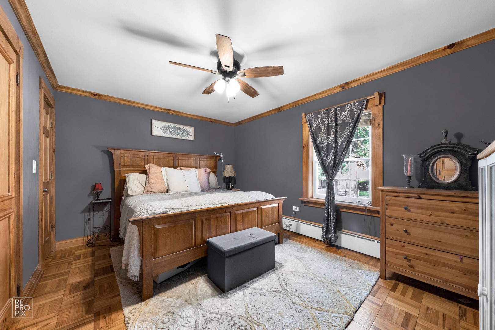 348 Ridge Avenue, Unit 1 Evanston, IL 60202 - Photo 7 of 9 a bedroom with a bed and a dresser