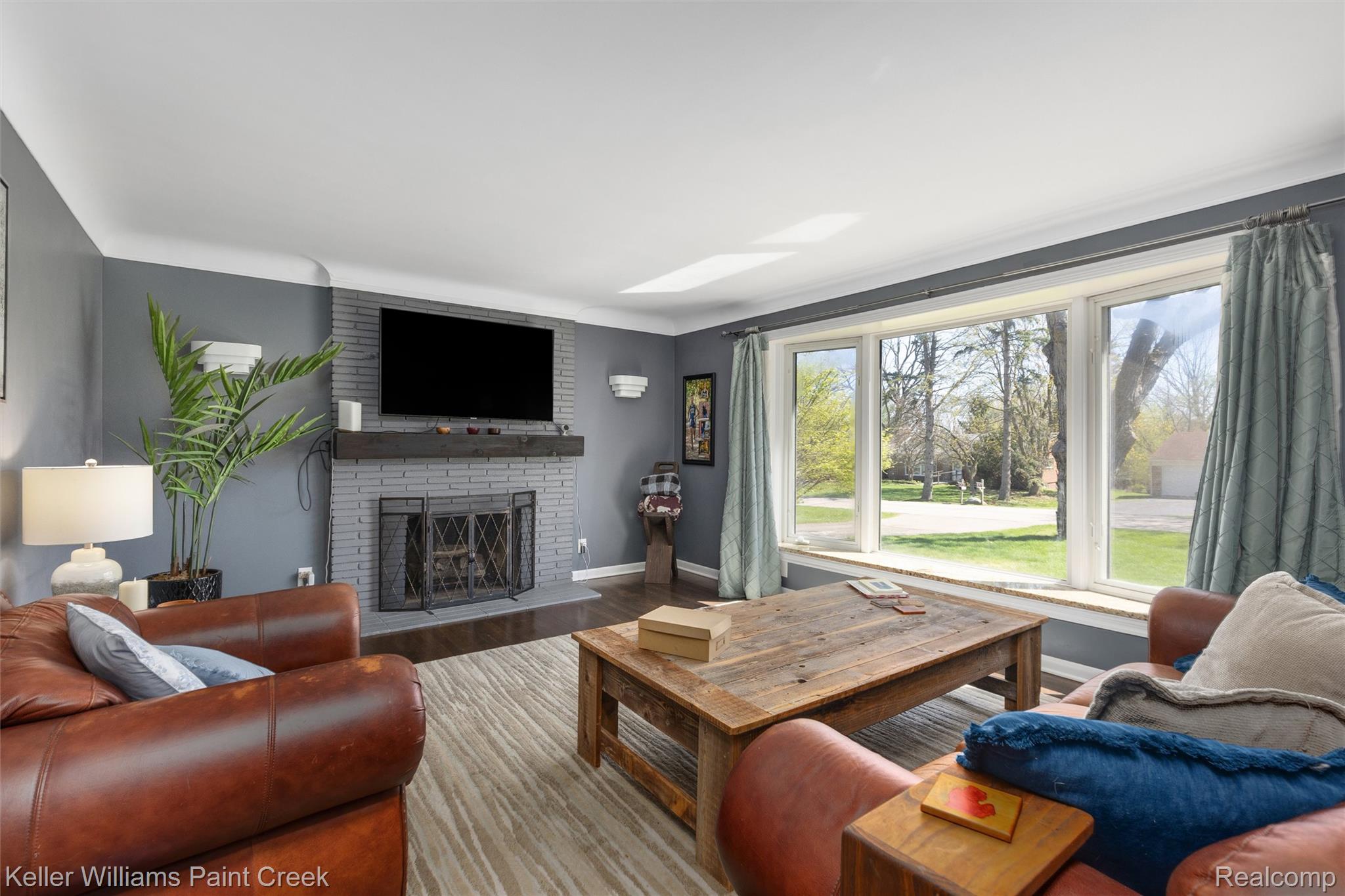 310 Elmhill Road Rochester, MI 48306 - Photo 3 of 37 Living room with a fireplace and wood finished floors