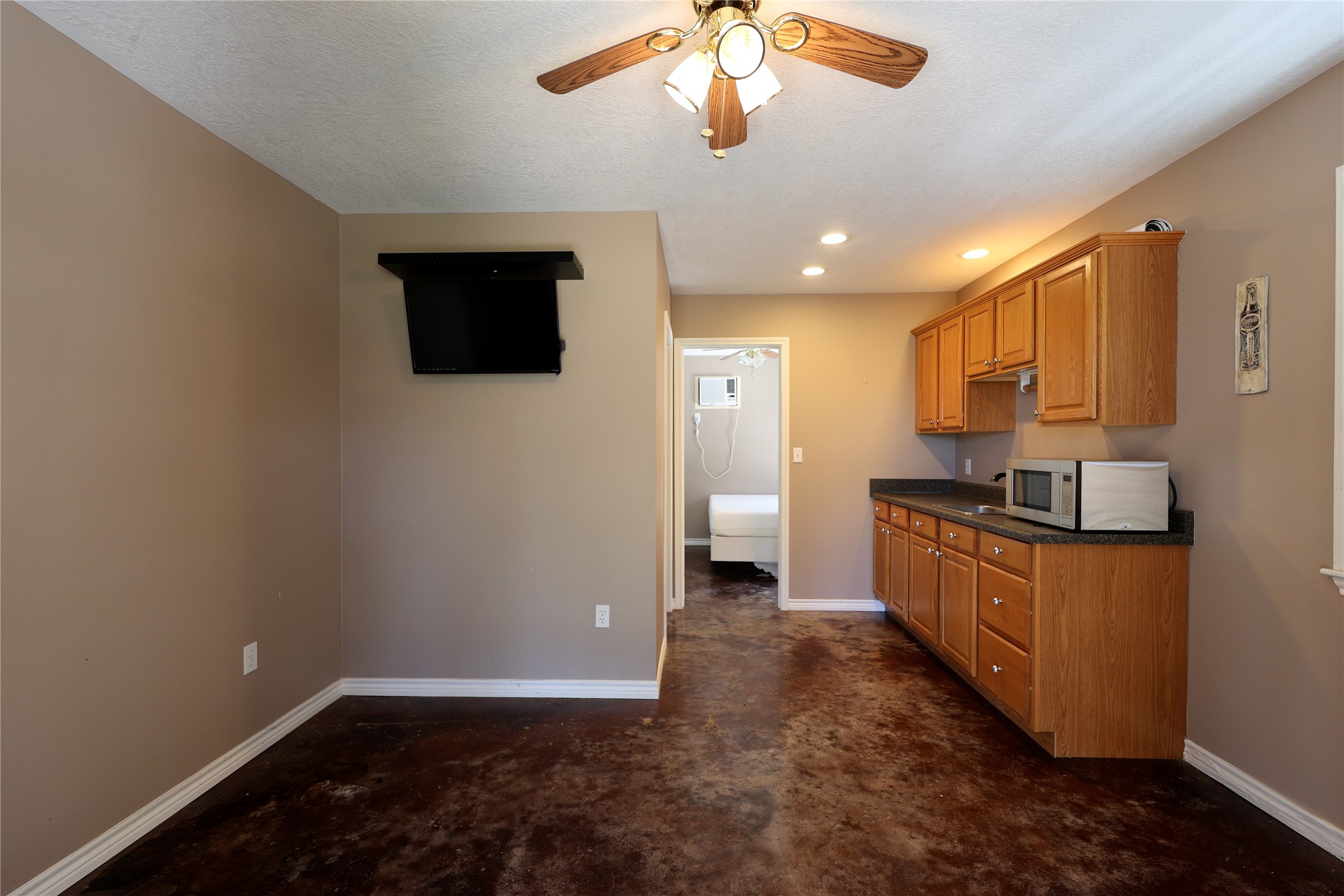 3337 Brunes Mill Road Columbus, TX 78934 - Photo 27 of 48 a kitchen with a refrigerator and a sink