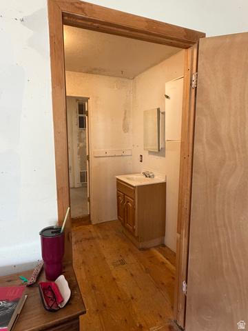 255 E Centre Spring City, UT 84662 - Photo 13 of 34 Wood-finish flooring with a light-toned vanity and integrated sink