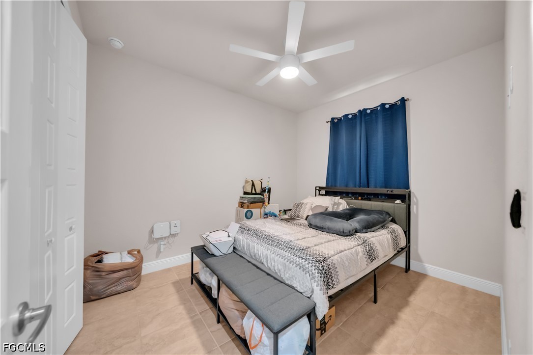 384 Neighborly Road LaBelle, FL 33935 - Photo 24 of 45 a bedroom with a bed and a couch