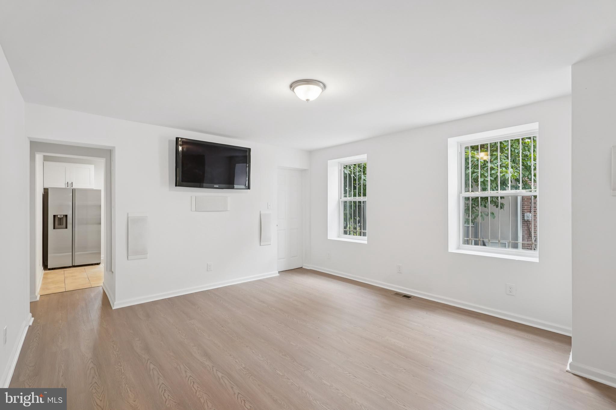 200 East Price Street Philadelphia, PA 19144 - Photo 13 of 29 wooden floor in an empty room with a window