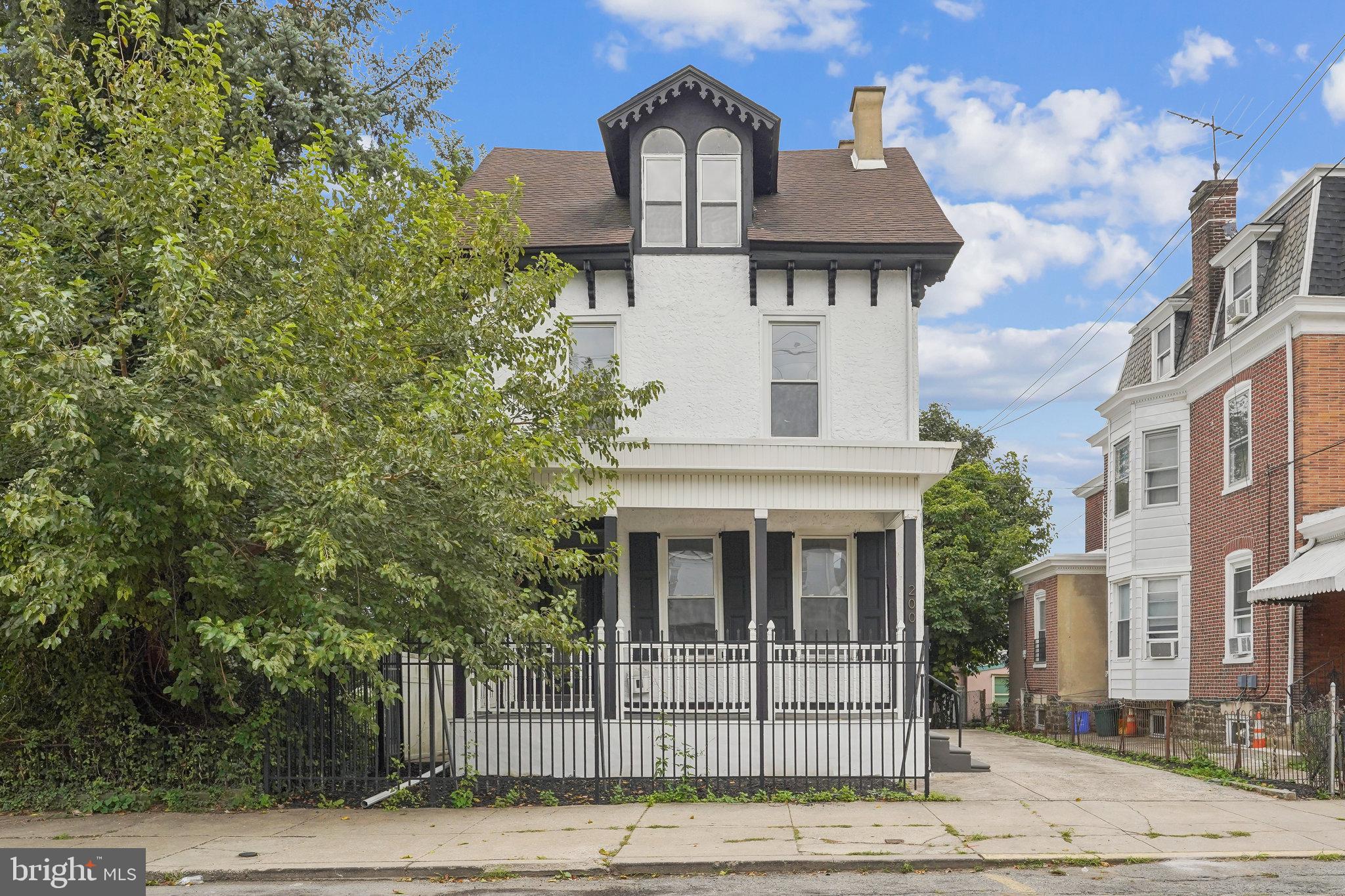 200 East Price Street Philadelphia, PA 19144 - Photo 2 of 29 a front view of a house with a yard