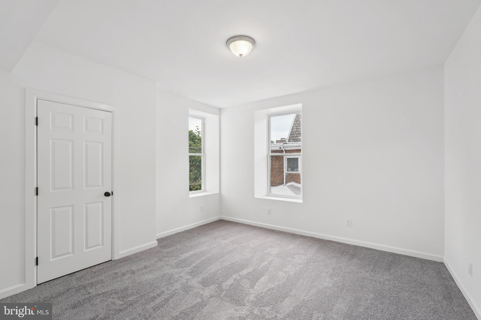 200 East Price Street Philadelphia, PA 19144 - Photo 21 of 29 an empty room with windows and entrance