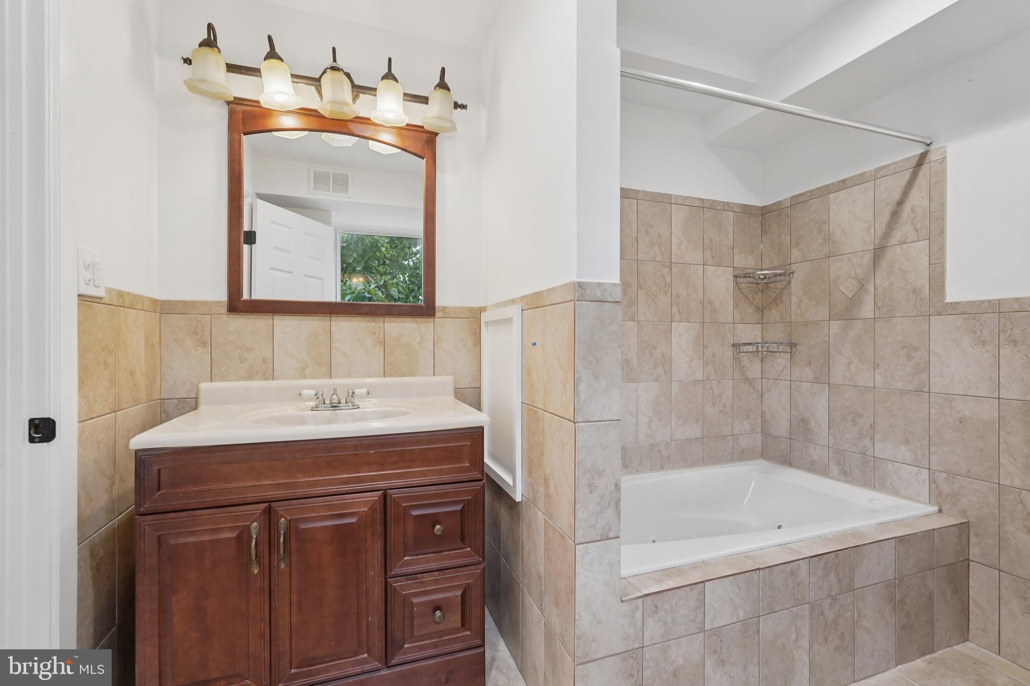 200 East Price Street Philadelphia, PA 19144 - Photo 22 of 29 a bathroom with a sink and a mirror