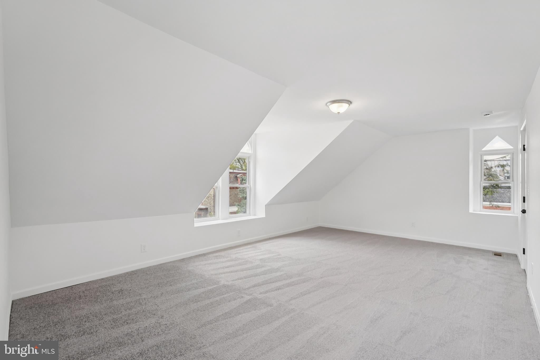200 East Price Street Philadelphia, PA 19144 - Photo 27 of 29 a view of an empty room with wooden floor and a window