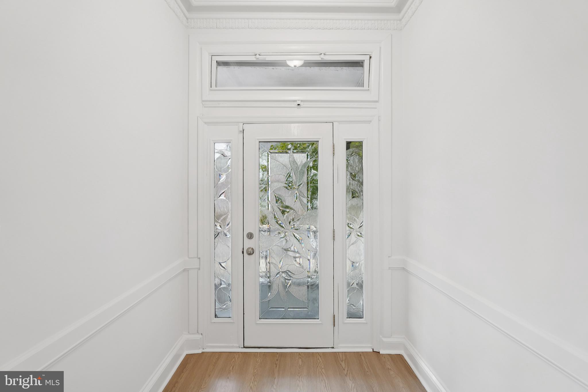 200 East Price Street Philadelphia, PA 19144 - Photo 9 of 29 a view of a hallway with wooden floor and staircase